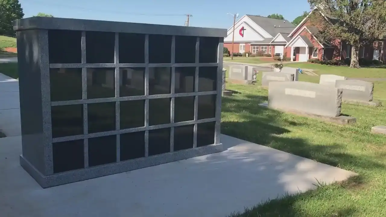 Polished granite columbarium wall with engraved niche fronts, built in Los Angeles by Memoria Columbaria